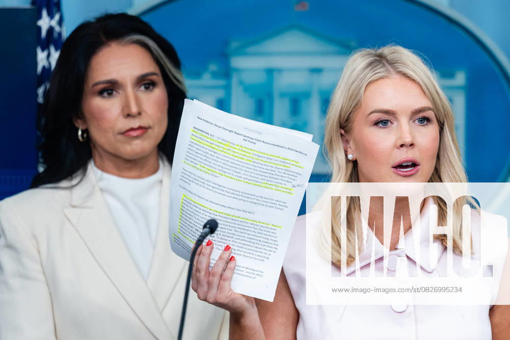 Karoline Leavitt, White House press secretary, holds up a memo as she speaks next to Tulsi Gabbard, director of National Intelligence, during a news conference in the James S. Brady Press Briefing Room of the White House in Washington, DC, US, on Wednesday, July 23, 2025. Tensions between the Trump administration and the judiciary flared on Tuesday when Attorney General Pam Bondi removed a US attorney for New Jersey that had been named by federal judges to replace the president s choice. WASP20250723108 EricxLee