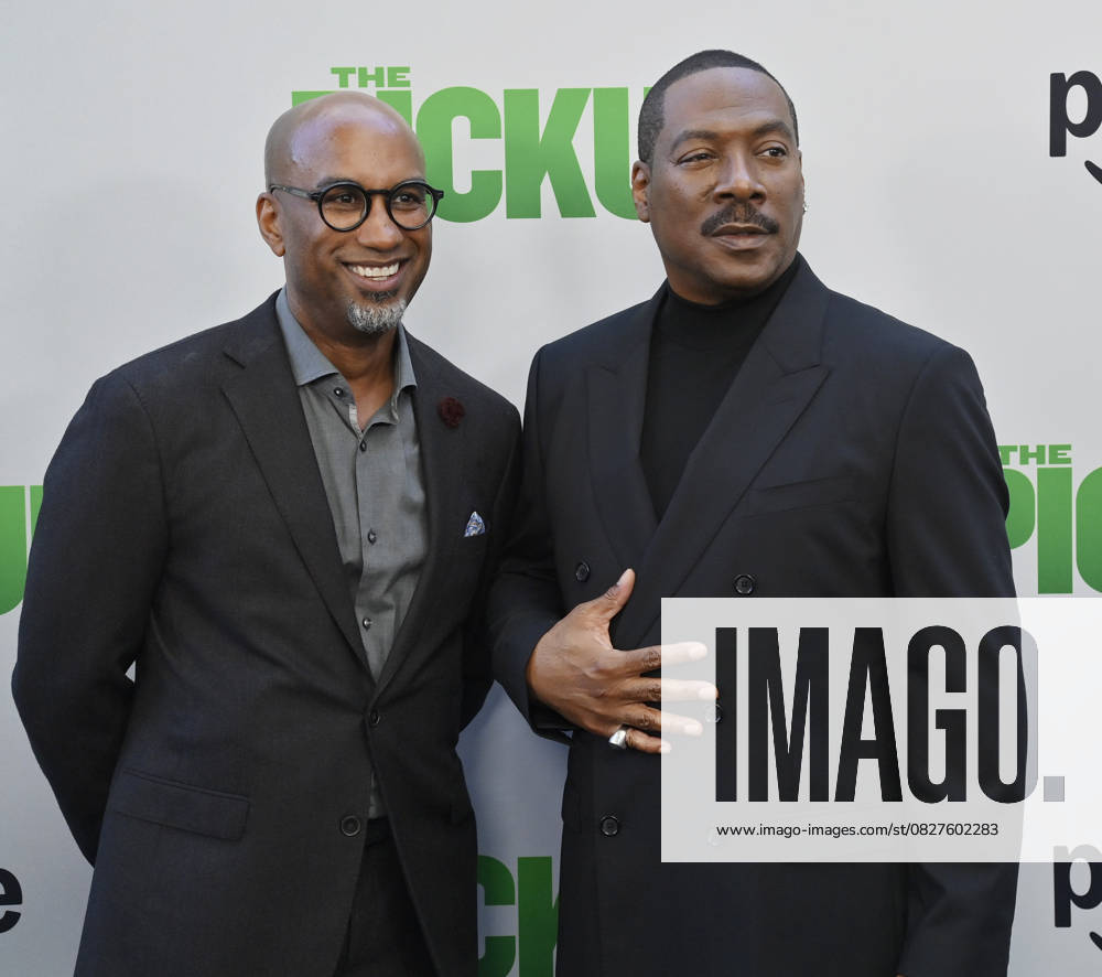 Director Tim Story (L) and cast member Eddie Murphy attend the premiere of the motion picture comedy The Pickup at Regal LA Live in Los Angeles on Sunday, July 27, 2025. Storyline: A routine cash pickup turns into a deadly pursuit when two mismatched armored truck drivers are ambushed by ruthless criminals with plans beyond the cash. LAP2025072745 JIMxRUYMEN
