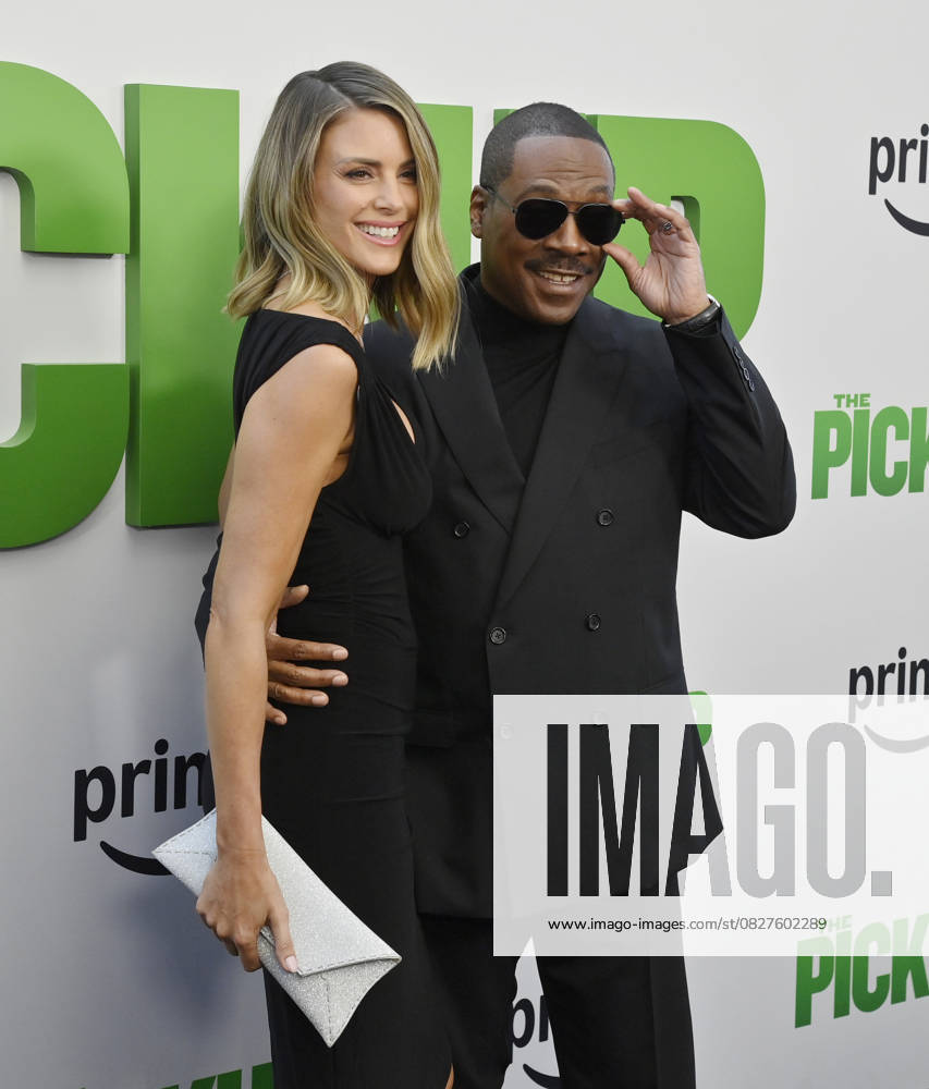 Cast member Eddie Murphy and his wife Paige Butcher attend the premiere of the motion picture comedy The Pickup at Regal LA Live in Los Angeles on Sunday, July 27, 2025. Storyline: A routine cash pickup turns into a deadly pursuit when two mismatched armored truck drivers are ambushed by ruthless criminals with plans beyond the cash. LAP2025072750 JIMxRUYMEN