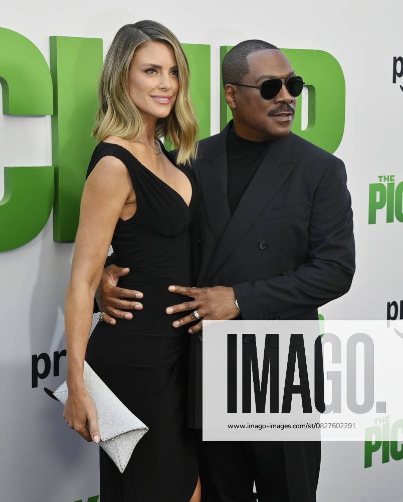 Cast member Eddie Murphy and his wife Paige Butcher attend the premiere of the motion picture comedy The Pickup at Regal LA Live in Los Angeles on Sunday, July 27, 2025. Storyline: A routine cash pickup turns into a deadly pursuit when two mismatched armored truck drivers are ambushed by ruthless criminals with plans beyond the cash. LAP2025072752 JIMxRUYMEN