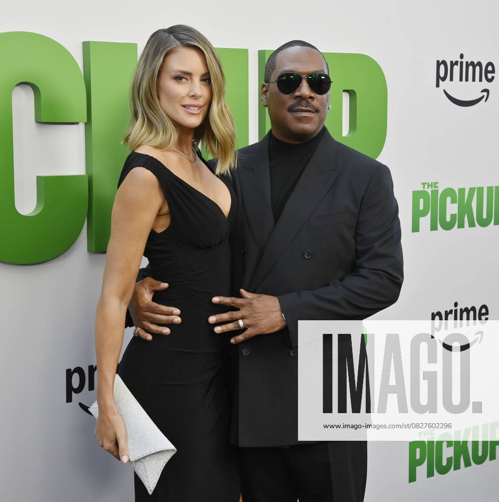 Cast member Eddie Murphy and his wife Paige Butcher attend the premiere of the motion picture comedy The Pickup at Regal LA Live in Los Angeles on Sunday, July 27, 2025. Storyline: A routine cash pickup turns into a deadly pursuit when two mismatched armored truck drivers are ambushed by ruthless criminals with plans beyond the cash. LAP2025072702 JIMxRUYMEN