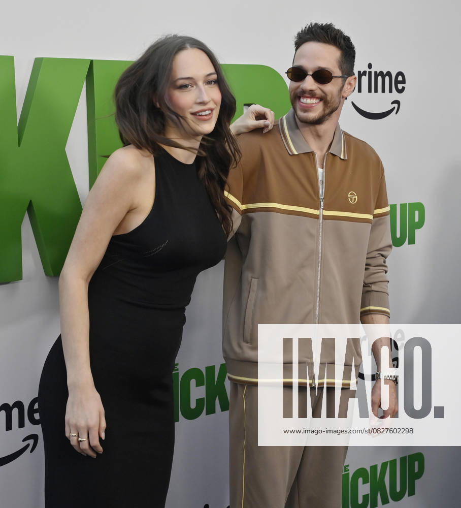 Cast member Pete Davidson (R) and Elsie Hewitt attend the premiere of the motion picture comedy The Pickup at Regal LA Live in Los Angeles on Sunday, July 27, 2025. Storyline: A routine cash pickup turns into a deadly pursuit when two mismatched armored truck drivers are ambushed by ruthless criminals with plans beyond the cash. LAP2025072703 JIMxRUYMEN
