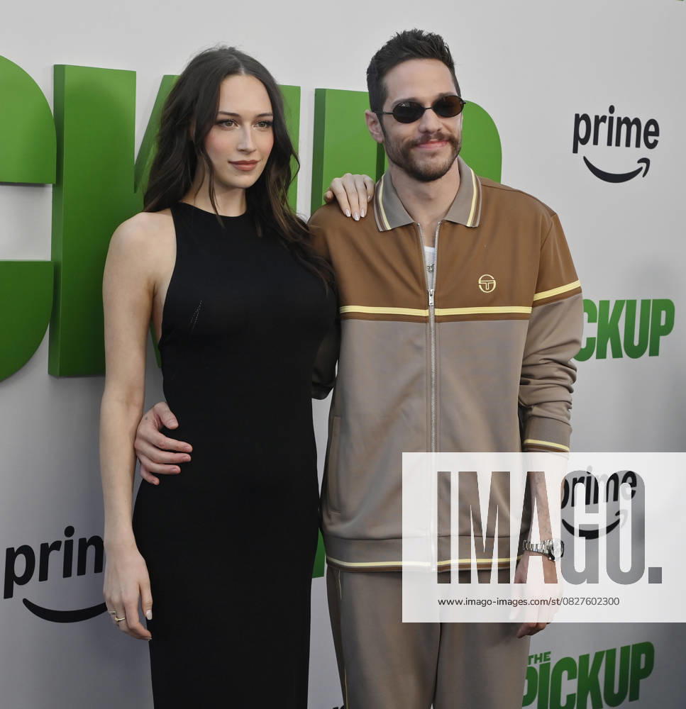 Cast member Pete Davidson (R) and Elsie Hewitt attend the premiere of the motion picture comedy The Pickup at Regal LA Live in Los Angeles on Sunday, July 27, 2025. Storyline: A routine cash pickup turns into a deadly pursuit when two mismatched armored truck drivers are ambushed by ruthless criminals with plans beyond the cash. LAP2025072705 JIMxRUYMEN