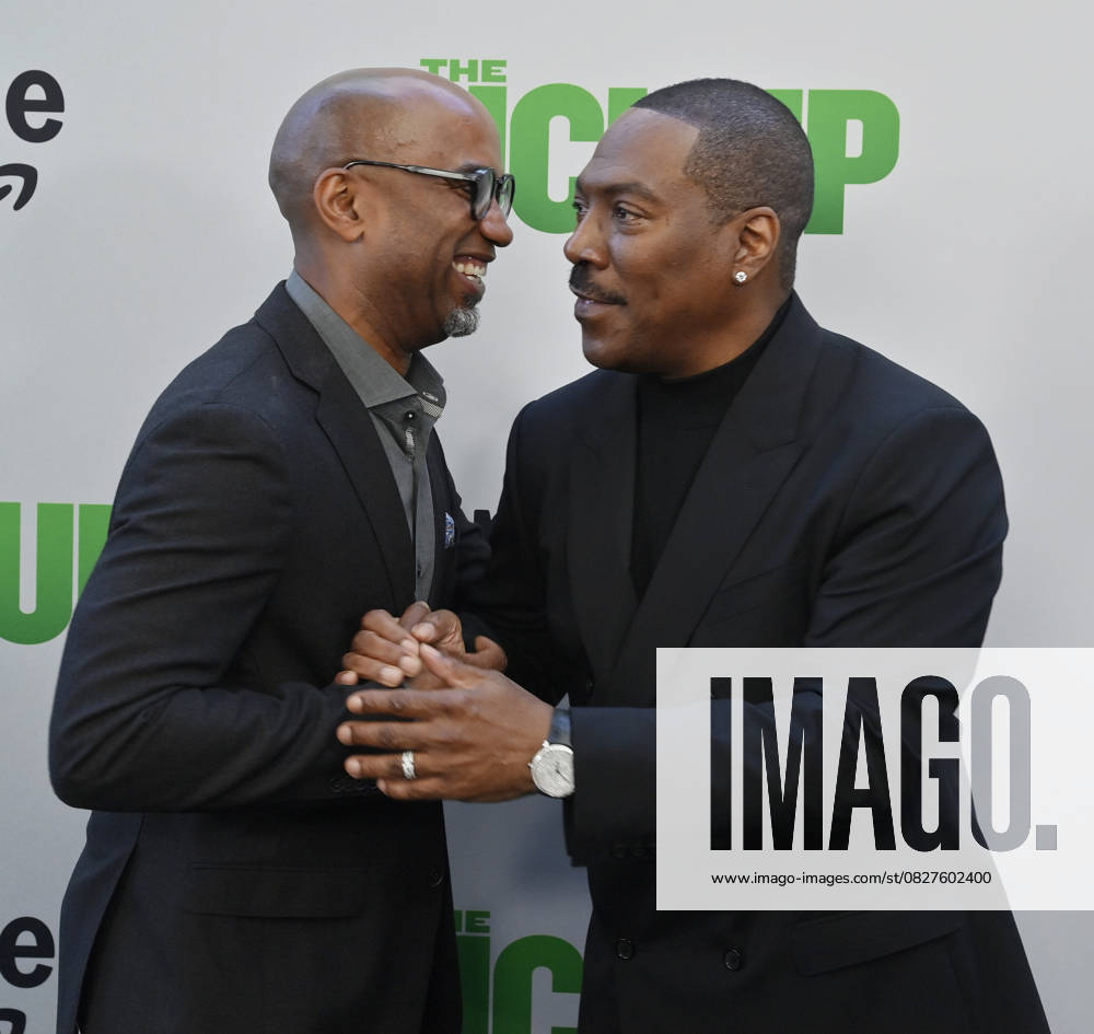 Director Tim Story (L) and cast member Eddie Murphy attend the premiere of the motion picture comedy The Pickup at Regal LA Live in Los Angeles on Sunday, July 27, 2025. Storyline: A routine cash pickup turns into a deadly pursuit when two mismatched armored truck drivers are ambushed by ruthless criminals with plans beyond the cash. LAP2025072743 JIMxRUYMEN