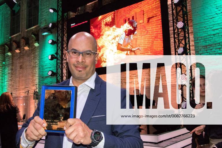 Venezuelan photojournalist Ronaldo Schemidt poses with his World Press Photo award in in Amsterdam, Netherlands, 12 April 2018. The winning picture portraits Jose Victor Salazar, a Venezuelan opposition protestor accidentally burnt during clashes past 03 May 2017 in Caracas. Venezuelan Ronaldo Schemidt wins World Press Photo award !ACHTUNG: NUR REDAKTIONELLE NUTZUNG!