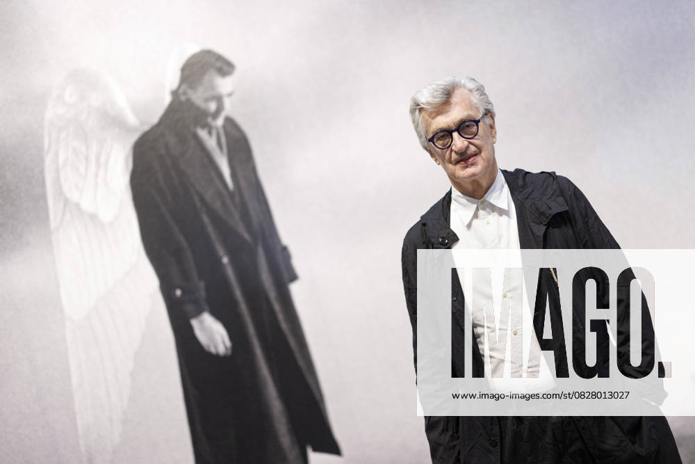 Film director Wim Wenders in front of a scene from his film The Sky Over Berlin at the press event for the immersive exhibition W I M The Art of Seeing at the Bundeskunsthalle In addition to his cinematic works, the exhibition also shows his complete artistic oeuvre such as photographic works and early collages and drawings Wenders will be 80 years
