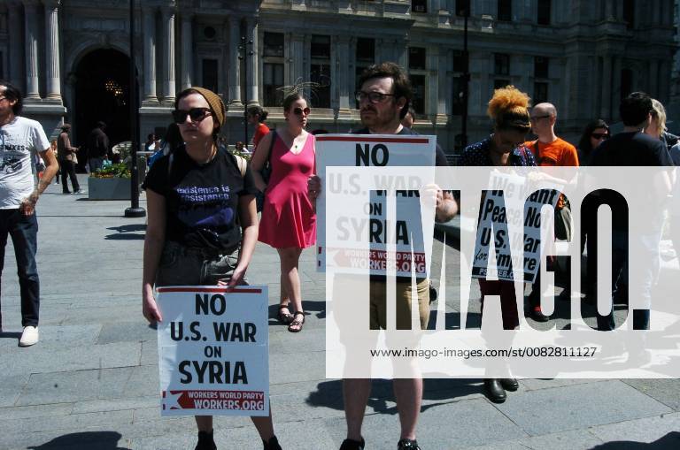 Philadelphia, Pennsylvania, United States - Antiwar protesters gathered in front of City Hall in downtown Philadelphia for an emergency rally demanding America not further entrench itself in the Syrian conflict and that American forces be pulled out of all middle east countries on April 14, 2018. Philadelphia United States - ZUMAn230 20030101_zaa_n230_451
