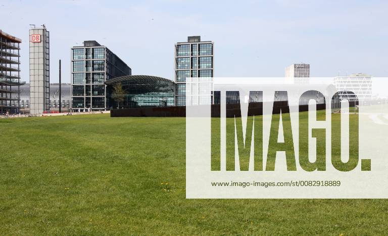 Berlin Central Station in bright sunshine 22 04 2018 Hauptbahnhof Exterior view GER Berlin Image View of the central station in bright sunshine in front of it green field in spring Berlin Berlin Germany Government district