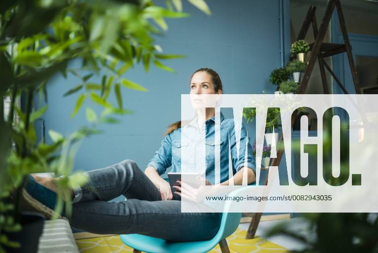 Beautiful woman in her home, decorated with plants model released Symbolfoto property released MOEF00886