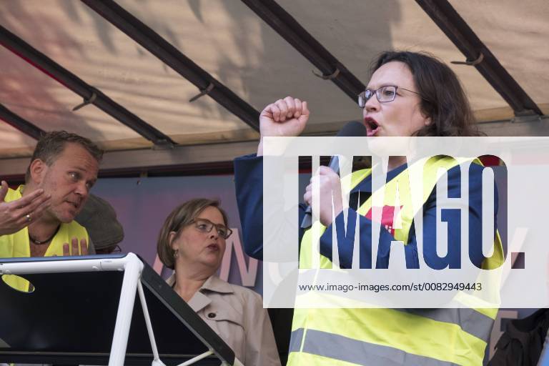 Party leader Andrea Nahles SPD speaks to Amazon employees during a protest action by the United Services Union ver di against the award of the Axel Springer Award to Amazon boss Jeff Bezos in front of Axel Springer Verlag in Berlin Employees protest against the presentation of the Axel Springer Award to Amazon boss Bezos