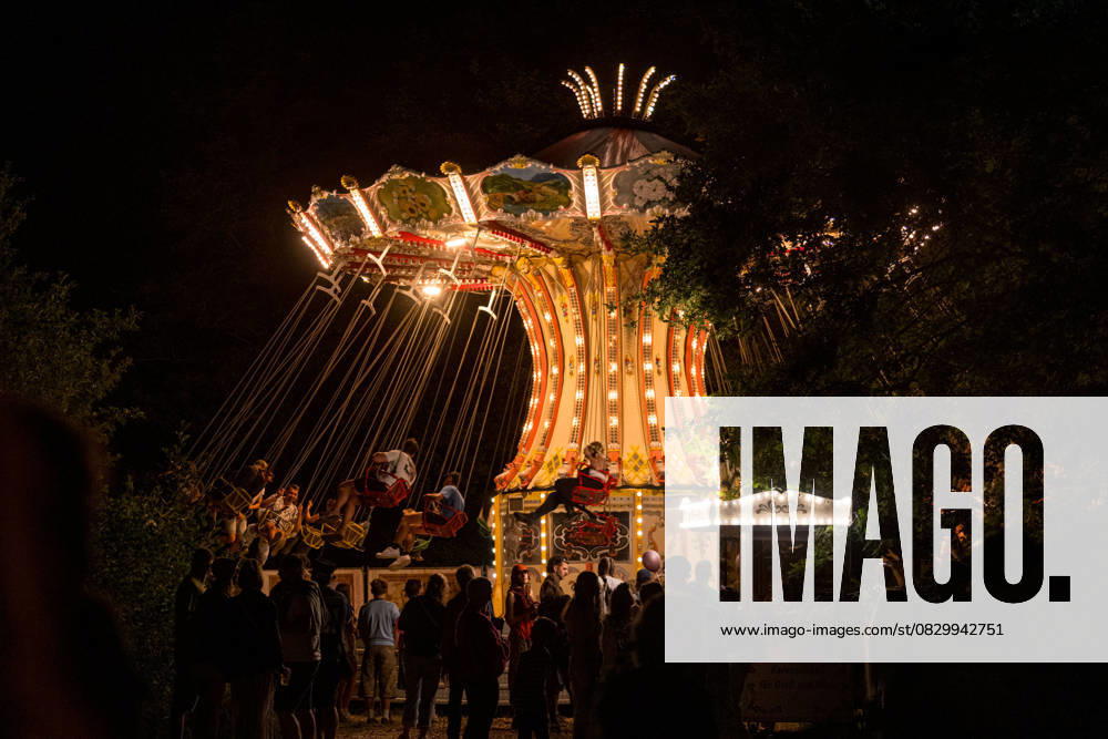 Ribnitz Damgarten, Germany 09 August 2025 About You Pangea Festival 2025 In the picture illuminated chain carousel in the dark at the festival
