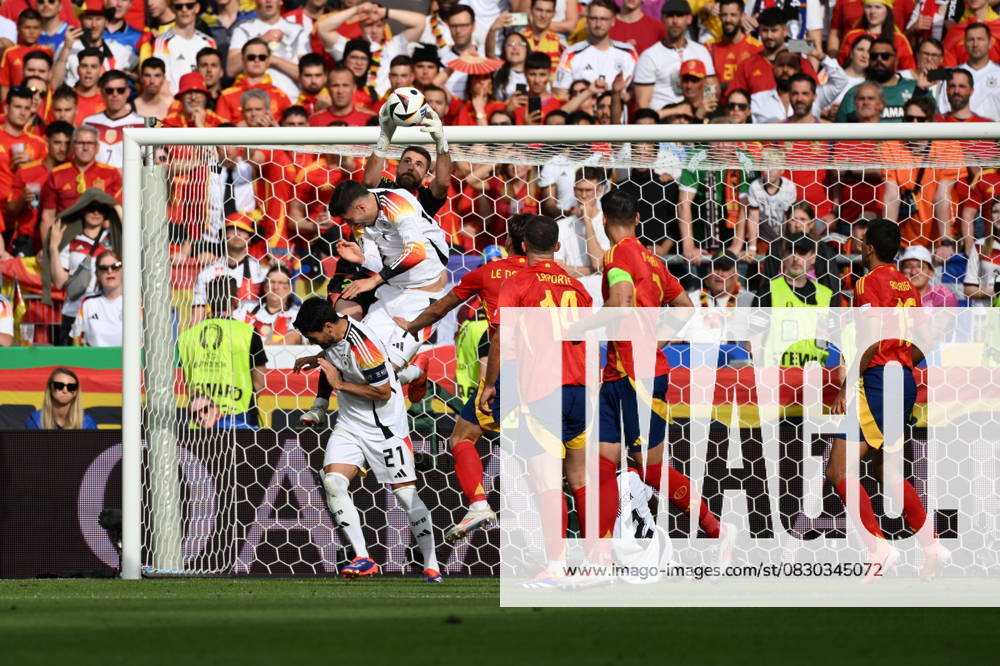 Spain v Germany: Quarter-Final - UEFA EURO 2024 STUTTGART, GERMANY - JULY 05: Spanish goalkeeper David Raya holds the ball after header from players of Germany Ilkay Gundogan (21) and Kai Havertz during the UEFA EURO 2024 quarter-final match between Spain and Germany at Stuttgart Arena on July 05, 2024 in Stuttgart, Germany. Germany World. Editorial use only. Please get in touch for any other usage.