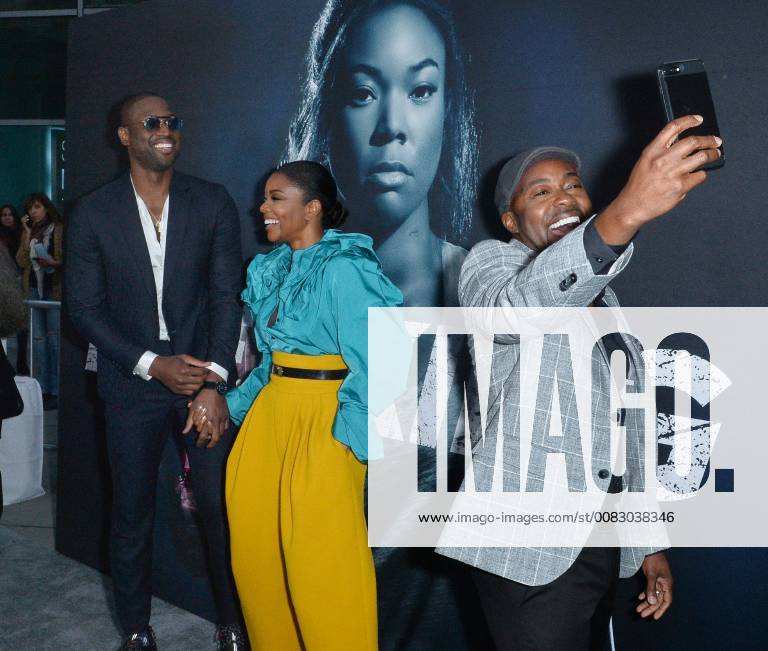 Cast member Gabrielle Union and her husband, NBA player Dwayne Wade react as producer Will Packer does a selfie during the special screening of the motion picture thriller Breaking In at the ArcLight Cinema Dome in the Hollywood section of Los Angeles on May 1, 2018. Storyline: A woman fights to protect her family during a home invasion. LAP2018050112 JIMxRUYMEN