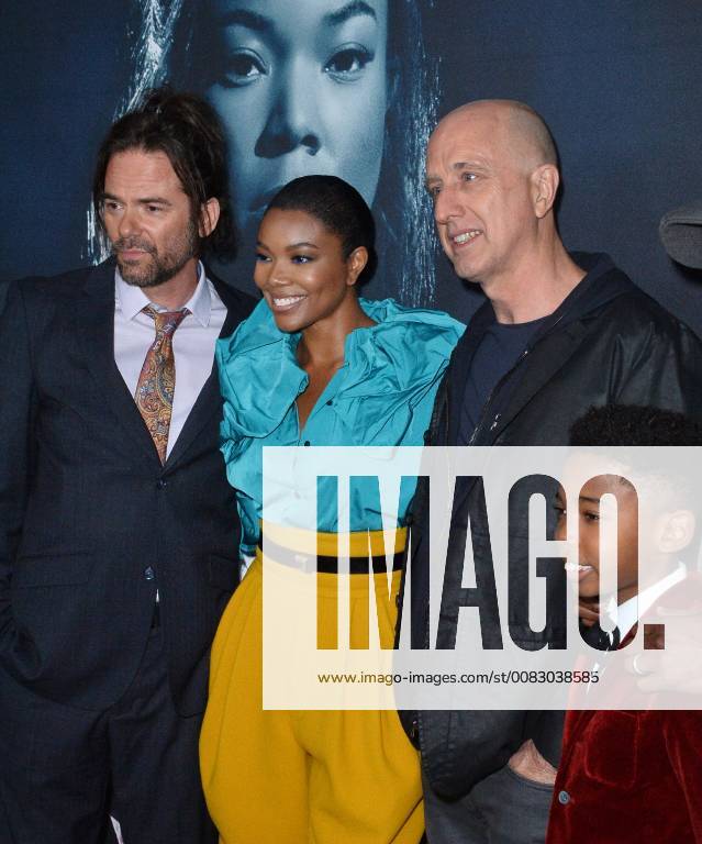 Cast members Billy Burke, Gabrielle Union and Seth Carr (L-R) join director James McTeigue (3rd-L) on the carpet for a photo-op during the special screening of the motion picture thriller Breaking In at the ArcLight Cinema Dome in the Hollywood section of Los Angeles on May 1, 2018. Storyline: A woman fights to protect her family during a home invasion. LAP2018050128 JIMxRUYMEN