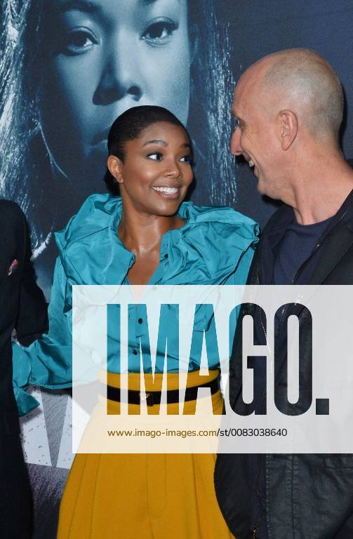 Cast member Gabrielle Union and director James McTeigue mingle on the carpet during the special screening of the motion picture thriller Breaking In at the ArcLight Cinema Dome in the Hollywood section of Los Angeles on May 1, 2018. Storyline: A woman fights to protect her family during a home invasion. LAP2018050199 JIMxRUYMEN