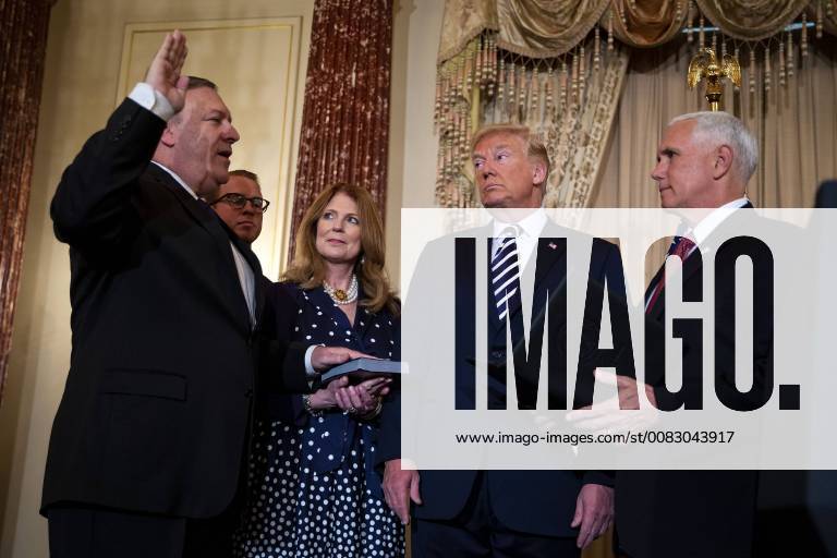 Mike Pompeo, U.S. secretary of state, is sworn in by Vice President Mike Pence, as U.S. President Donald Trump, Susan Pompeo, and Nick Pompeo look on, at the State Department, in Washington, D.C. on May 2, 2018. WAX20180502212 ALxDRAGO