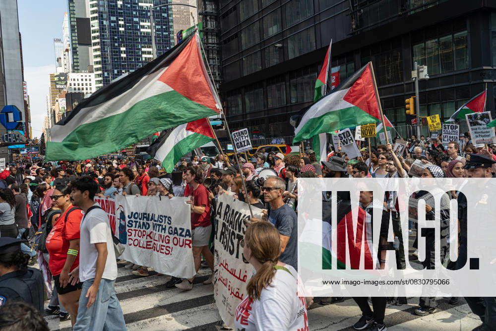 Protesters Gather To March In Solidarity With Gaza in New York, USA - 18 Aug 2025 Pro-Palestinian carry placards and banners as they march past Times Square during the Mass March for Humanity demonstration against the ongoing conflict and humanitarian crisis in Gaza. The WHO (World Health Organization) has warned that public health conditions in Gaza are catastrophic, with hospitals operating far beyond capacity while deaths from malnutrition and disease are on the rise. New York City United States