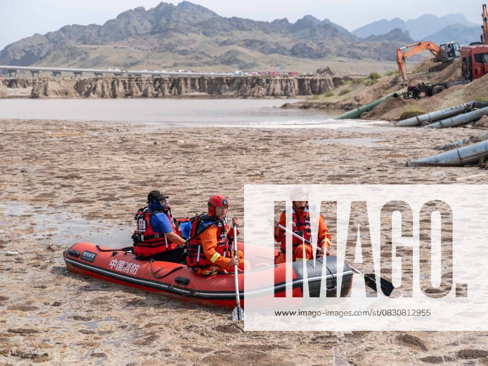 (250818) -- BAYANNUR, Aug. 18, 2025 -- Firefighters search for missing individuals in Urad Rear Banner of Bayannur City, north China s Inner Mongolia Autonomous Region on Aug. 18, 2025. The death toll from a flash flood that swept through a wild camping site in north China s Inner Mongolia Autonomous Region has risen to ten, with two people still missing, local emergency authorities said on Sunday. More than 700 rescuers have been promptly dispatched to the site, urgently searching for the missing. ) (SpotNews)CHINA-INNER MONGOLIA-BAYANNUR-FLASH FLOOD-RESCUE (CN) MaxJinrui