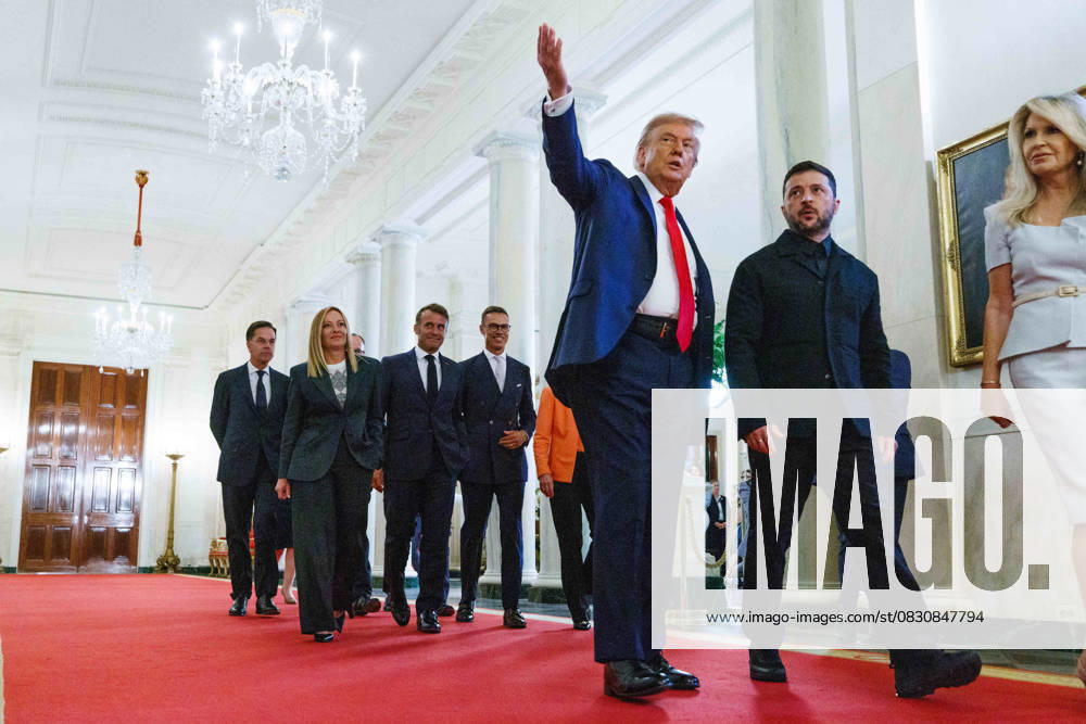 Trump Meets President Zelenskyy of Ukraine and European Leaders United States President Donald J Trump leads President Volodymyr Zelenskyy of Ukraine and President Ursula von der Leyen of the European Commission, Prime Minister Keir Starmer of the United Kingdom, President Alexander Stubb of Finland President Emmanuel Macron of France, Prime Minister Giorgia Meloni of the Italian Republic Chancellor Friedrich Merz of Germany Mark Rutte, Secretary General of the North Atlantic Treaty Organization (NATO) in Cross Hall of the White House in Washington, DC, USA, on Monday, August 18, 2025. European Leaders are at the White House in support of President Zelenskyy following President Trump’s meeting with President Vladimir Putin of Russia in Anch