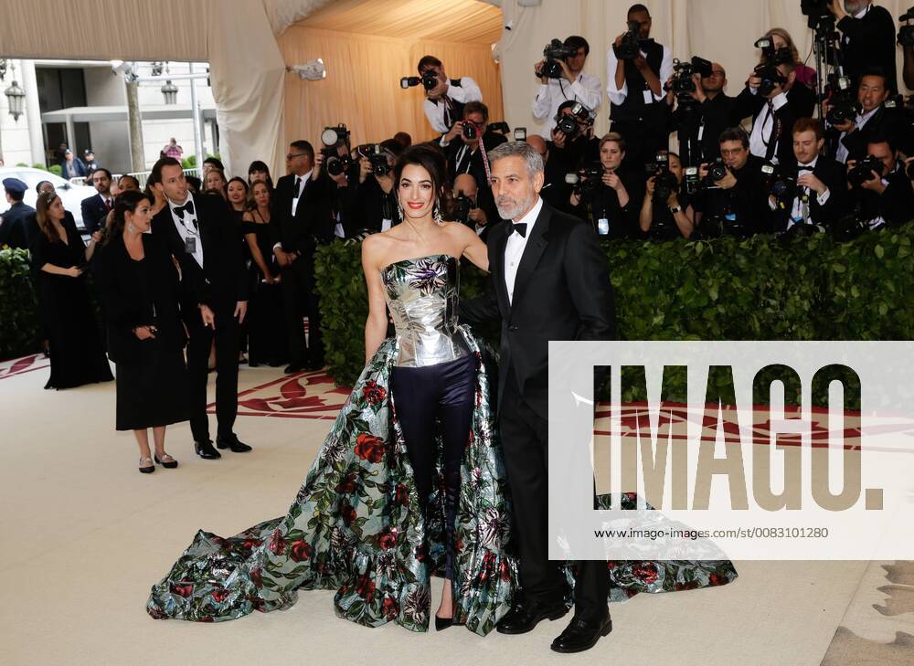 Amal Clooney and George Clooney arrive on the red carpet at The Metropolitan Museum of Art s Costume Institute Benefit Heavenly Bodies: Fashion and the Catholic Imagination at Metropolitan Museum of Art in New York City on May 7, 2018. NYP20180507208 JOHNxANGELILLO