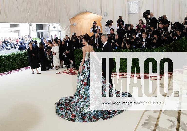 Amal Clooney and George Clooney arrive on the red carpet at The Metropolitan Museum of Art s Costume Institute Benefit Heavenly Bodies: Fashion and the Catholic Imagination at Metropolitan Museum of Art in New York City on May 7, 2018. NYP20180507209 JOHNxANGELILLO