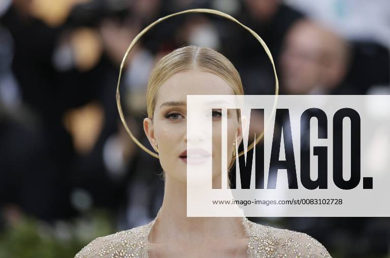 Rosie Huntington-Whiteley arrives on the red carpet at The Metropolitan Museum of Art s Costume Institute Benefit Heavenly Bodies: Fashion and the Catholic Imagination at Metropolitan Museum of Art in New York City on May 7, 2018. NYP20180507813 JOHNxANGELILLO