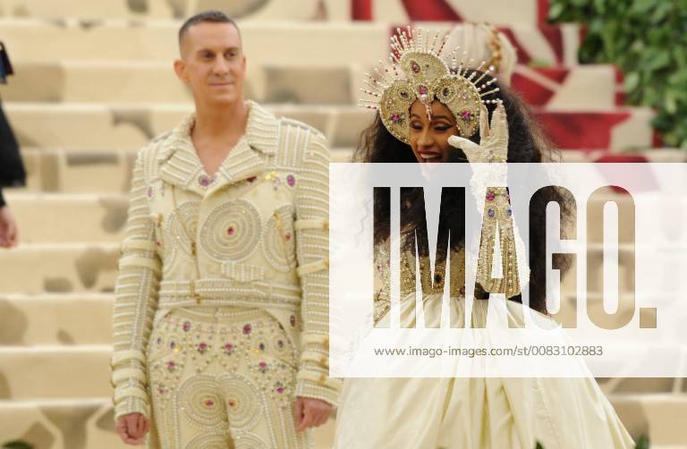 NEW YORK, NY - MAY 7: Cardi B and Jeremy Scott at the Heavenly Bodies: Fashion & The Catholic Imagination Costume Institute Gala on May 7, 2018 in New York City.