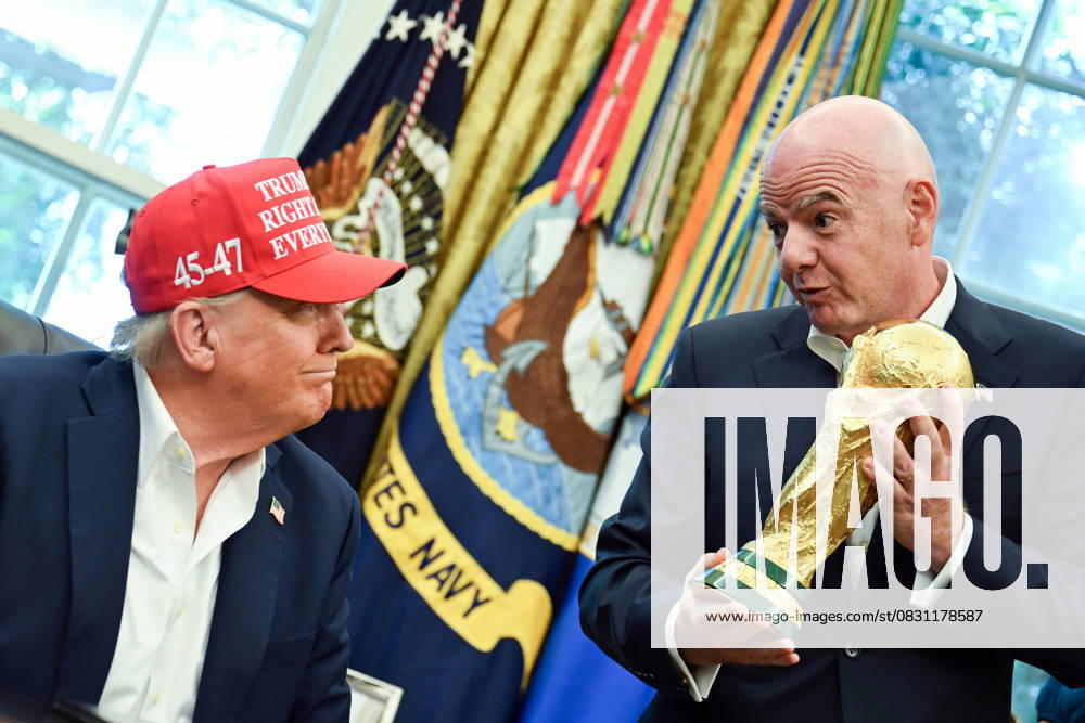 FIFA President Gianni Infantino hands President Donald Trump the FIFA World Cup trophy after announcing the 2026 World Cup draw will be held at the Kennedy Center in December in the Oval Office of the White House in Washington, DC on Friday, August 22, 2025. The FIFA World Cup, coming to North America next summer will be the first World Cup with three host countries in the U.S., Canada and Mexico, and it will be the first to feature a 48-team field. WAP20250822345 BONNIExCASH