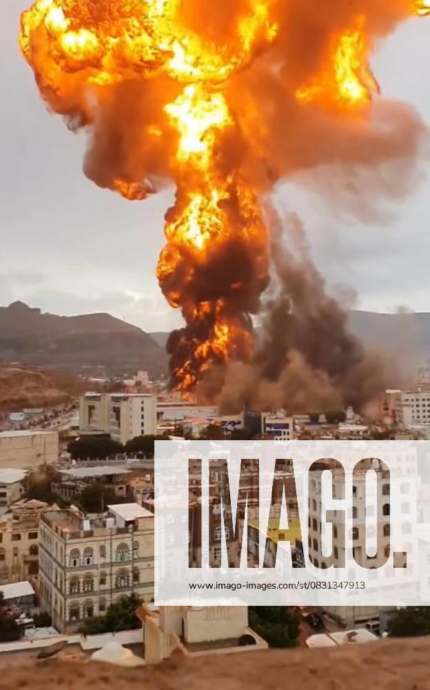 (250824) -- SANAA, Aug. 24, 2025 () -- This screenshot taken from a video by cellphone shows flame and smoke rising during airstrikes in Sanaa, Yemen, Aug. 24, 2025. Israeli warplanes launched a wave of airstrikes on Yemen s capital Sanaa on Sunday, targeting government and military sites, Houthi-run al-Masirah television reported. () YEMEN-SANAA-ISRAEL-AIRSTRIKES Xinhua