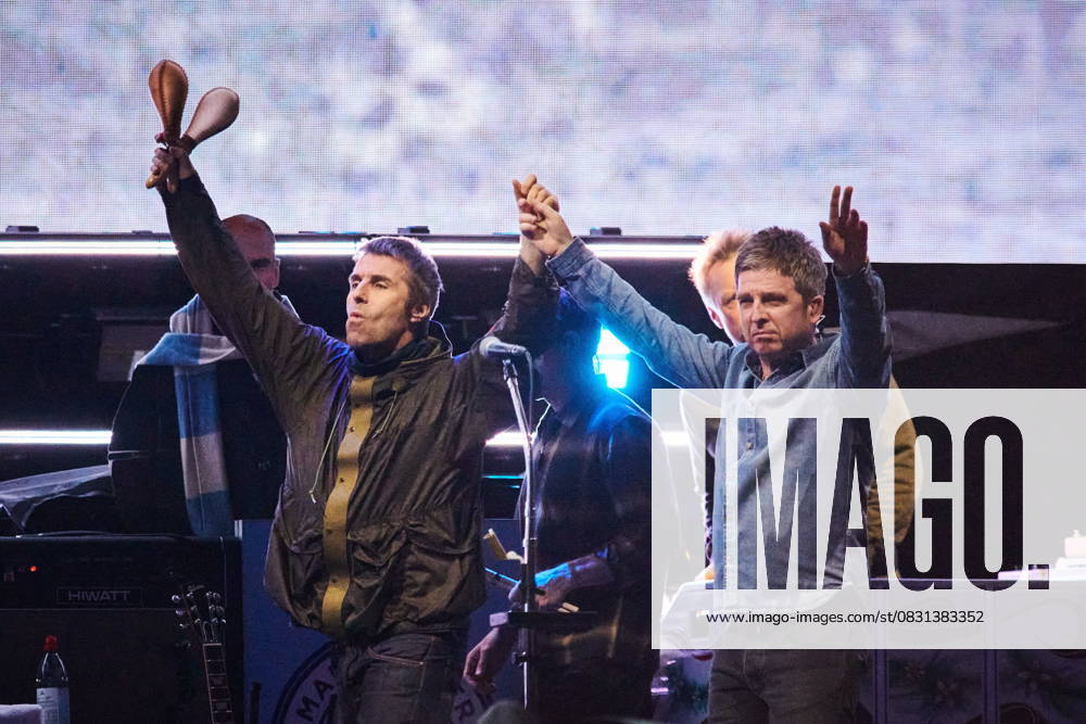 Liam Gallagher (left) and Noel Gallagher of Oasis walk onstage together during their reunion tour in Toronto, on Sunday, Aug. 24, 2025. Toronto Canada - ZUMAc35_ 20250824_zaf_c35_242