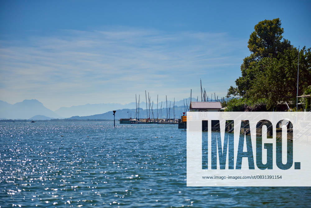 Germany, Lindau island city houses at bodensee lake water panorama view to austrian mountains, alps, pfaender peak and nature landscape. Germany, Lindau island city houses at bodensee lake water panorama view to austrian mountains, alps, pfaender peak and nature landscape., 63143648.jpg RECORD DATE NOT STATED