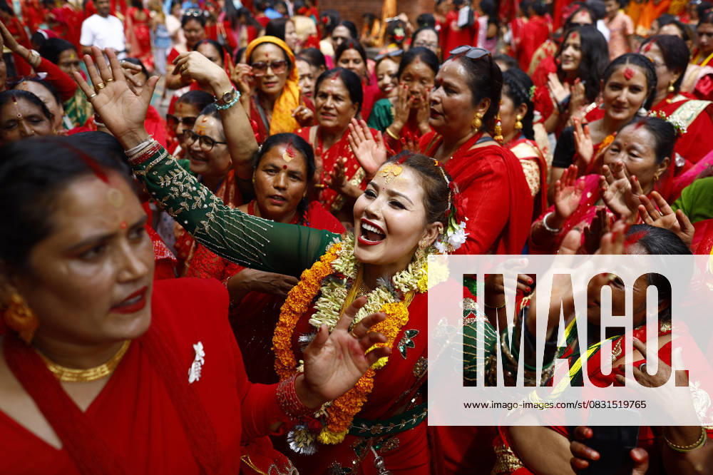 Nepalese Hindu women sing and dance during the Teej festival at Pashupatinath Temple in Kathmandu, Nepal, on Tuesday, August 26, 2025. Married and unmarried women observe fasting during the festival. Married women abstain from food and water, praying for the longevity, peace, and prosperity of their husbands and families, while unmarried women fast in the hope of being blessed with a good husband. Kathmandu Nepal - ZUMAg200 20250826_zap_g200_012