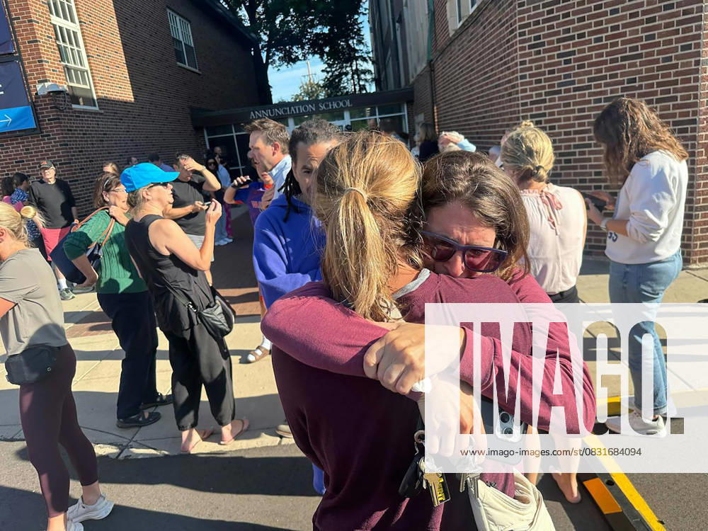 Parents await news of their children after a shooting near Annunciation Church in Minneapolis on Wednesday morning. Two young children were killed and 17 others were injured in the mass shooting at the Church. The gunman fired a rifle through the church windows towards children and worshippers. An 8-year-old and a 10-year-old were killed while they sat in the pews. Of the 17 others injured, 14 are children. Two of them are in critical condition. The gunman was in his 20s, and ultimately died of a self-inflicted gunshot wound. Minneapolis USA - ZUMAm67_ 20250827_zaf_m67_004