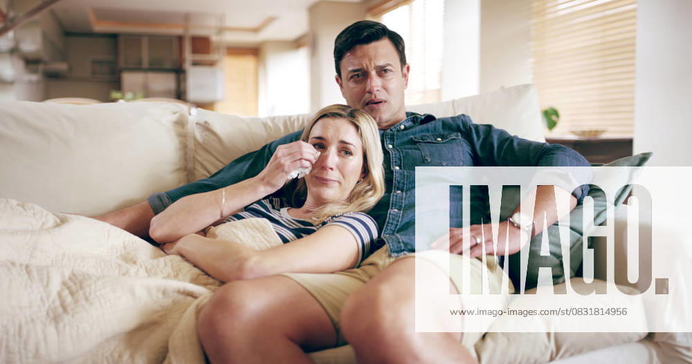 Watching TV, sad and couple crying in home for bad news, movie and support on sofa. Man, woman and emotional in living room with empathy, heartbroken and streaming media with care in relationship Watching TV, sad and couple crying in home for bad news, movie and support on sofa. Man, woman and emotional in living room with empathy, heartbroken and streaming media with care in relationship., model released, , property released, , 63197954.jpg RECORD DATE NOT STATED