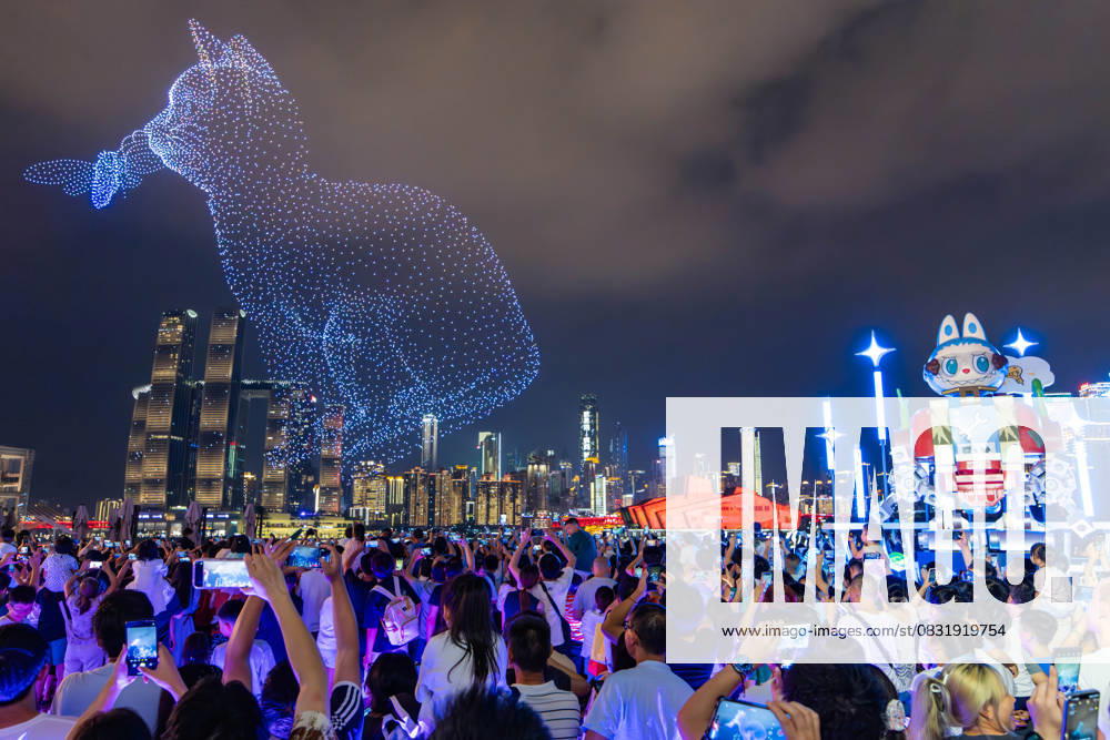 Drone Performance in Chongqing Tourists watch drone performances and a giant cyberpunk style LABUBU in Chongqing, China on August 30, 2025. Chongqing Chongqing China