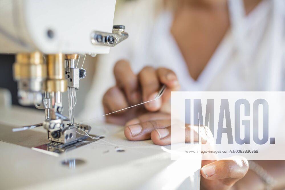 Close-up of woman using sewing machine model released Symbolfoto property released ZEF15320