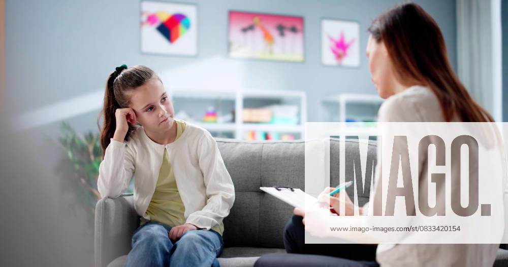 Psychiatrist comforting sad ADHD child during counseling therapy Psychiatrist comforting sad ADHD child during counseling therapy session., model released, , 94775270.jpg RECORD DATE NOT STATED
