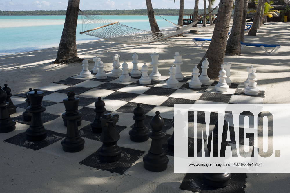 Cook Islands in the South Pacific Aitutaki. Cook Island. Polynesia. South Pacific Ocean. Giant chess set on the beach of the Aitutaki Lagoon Resort & Spa Hotel. With a lagoon that is arguably one of the most beautiful in the world, a cruise out on its pristine water is an absolute must. You are likely to be so enchanted, that you ll book another tour for the next day. Back on land, the island of Aitutaki has an interesting history and there are excavations of local marae underway. You can take a safari tour to these ancient places, explore the island and also find out about the legacy of the American troops stationed here during WWII. For novice scooter riders, Aitutaki is generally safer than Rarotonga where traffic can be quite busy at ti