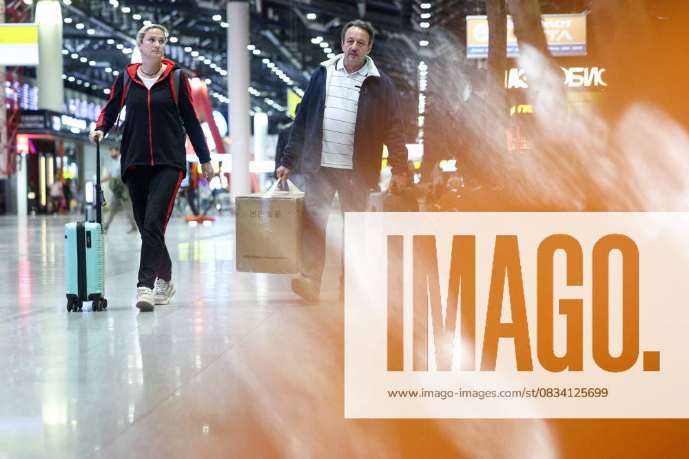 RUSSIA, MOSCOW REGION - SEPTEMBER 17, 2025: A woman wheels along her suitcase at Sheremetyevo International Airport. Sofya Sandurskaya TASS 84064015