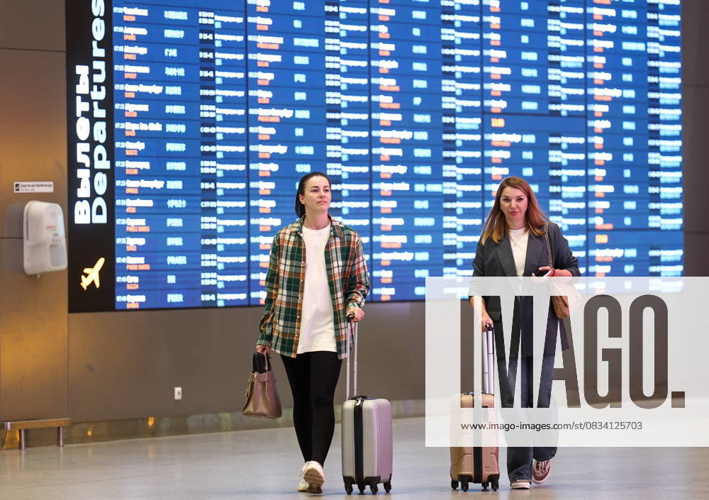 RUSSIA, MOSCOW REGION - SEPTEMBER 17, 2025: Women wheel along their suitcases at Sheremetyevo International Airport. Sofya Sandurskaya TASS 84063943