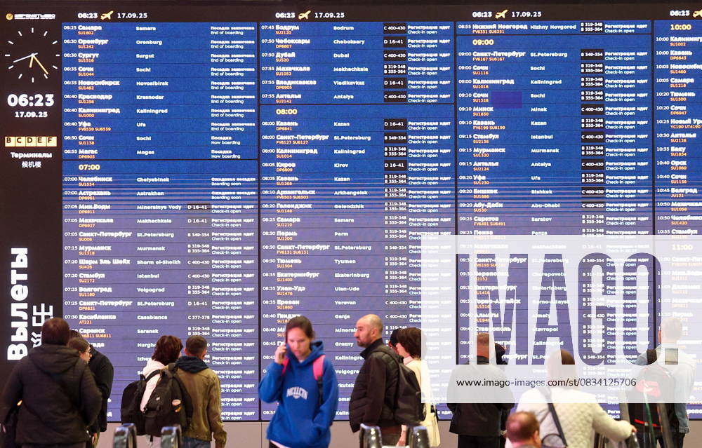 RUSSIA, MOSCOW REGION - SEPTEMBER 17, 2025: Travelers read a flight information display board at Sheremetyevo International Airport. Sofya Sandurskaya TASS 84063987
