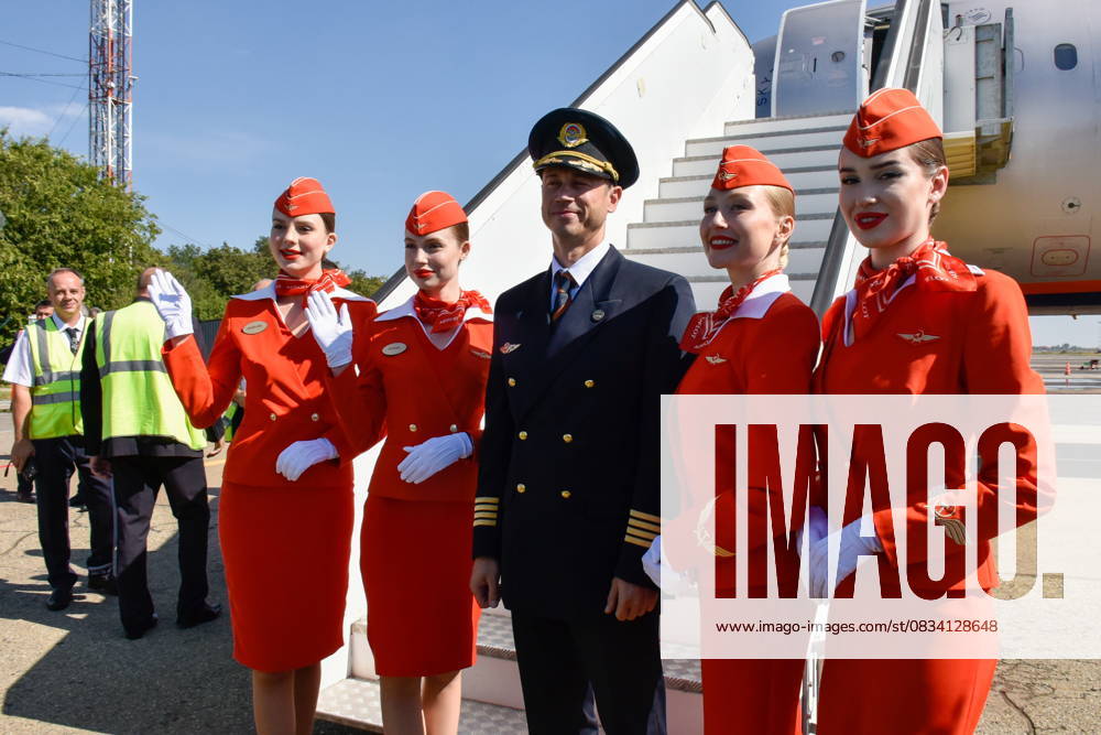 RUSSIA, KRASNODAR - SEPTEMBER 17, 2025: Members of the crew pose together outside their plane as an Aeroflot flight from Moscow arrives at Krasnodar International Airport. Operations resumed on 11 September 2025, it is the first civil flight to land here since 2022 Krasnodar Russia - ZUMAt113 20250917_zaa_t113_093