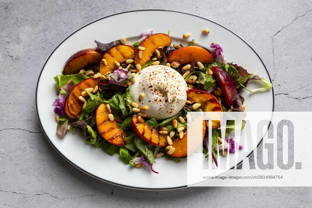 Grilled nectarine and burrata salad with pine nuts and edible flowers, SARF04684