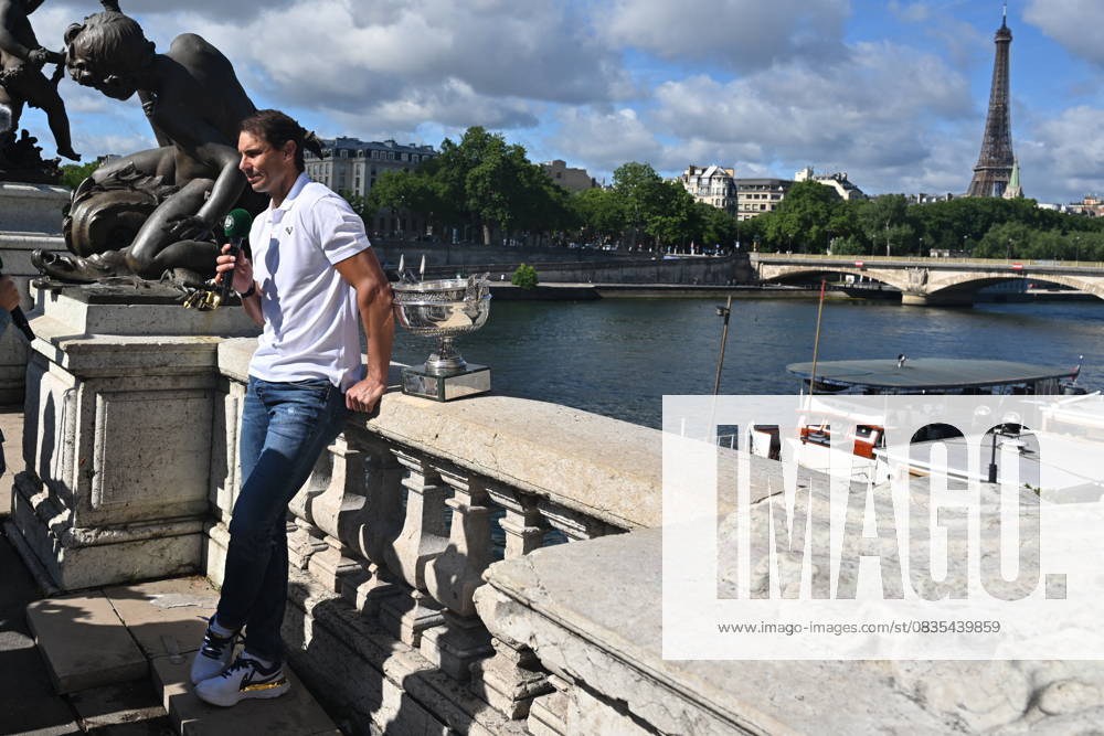 French Open Roland Garros 2022 PARIS, FRANCE - JUNE 06: Rafael Nadal of Spain, men’s single winner of the French Open (Roland Garros) 2022 tennis tournament, poses with his trophy during a photo session on the Pont Alexandre III (Alexandre III bridge) in Paris, France on June 06, 2022. France World. Editorial use only. Please get in touch for any other usage.