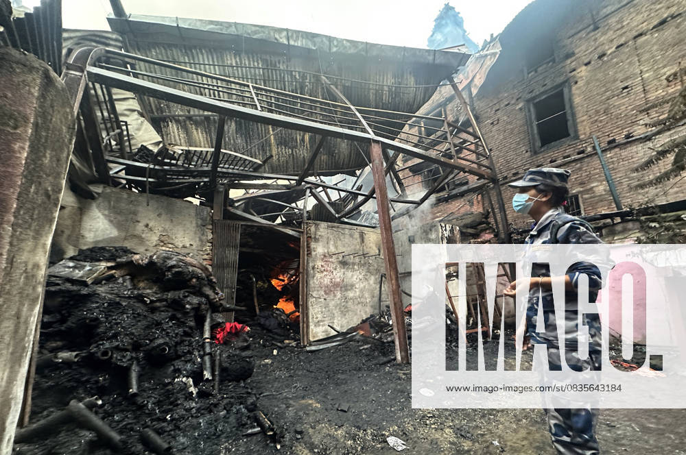 A security personnel work on to extinguish after a massive fire broke out at a clothing warehouse in Bhimsensthan, near Hanumandhoka, Kathmandu, on September 29, 2025. The fire quickly spread, affecting nearly half a dozen houses and even damaging parts of a nearby temple. The blaze was brought largely under control through a coordinated effort involving the Nepal Army, Nepal Police, fire engines, water tankers, and local residents. Authorities are investigating the cause of the fire. No casualties have been reported so far. Kathmandu Nepal - ZUMAs233 20250929_zap_s233_001