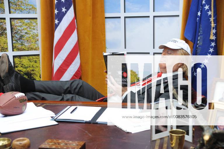 A President Trump impersonator poses in a mock up of the Oval office to promote the global release of James Patterson and Bill Clinton s book, The President is Missing, Waterloo Station in London. JUNE 4th 2018 TSTx182067
