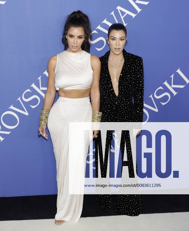 Kim Kardashian West and Kourtney Kardashian arrive on the red carpet at the 2018 CFDA Fashion Awards at Brooklyn Museum on June 4, 2018 in New York City. NYP20180604191 JOHNxANGELILLO