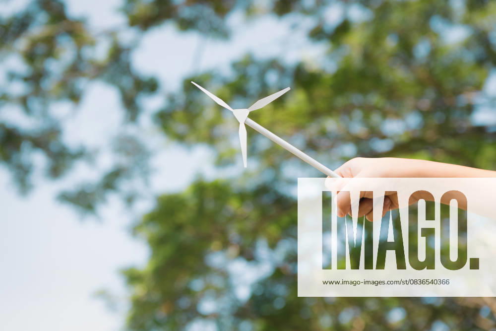 Little boy holding windmill or wind turbine mockup model. Gyre Little boy holding windmill or wind turbine mockup model to promote eco clean and renewable energy technology utilization for future generation and sustainable Earth. Gyre, model released, , 59448242.jpg RECORD DATE NOT STATED
