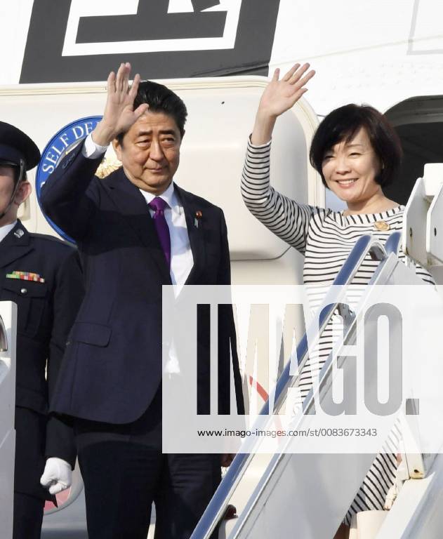 Japan PM Abe Japanese Prime Minister Shinzo Abe (L), alongside his wife Akie, waves before leaving Joint Base Andrews near Washington on June 7, 2018, for a Group of Seven summit in Quebec, Canada.