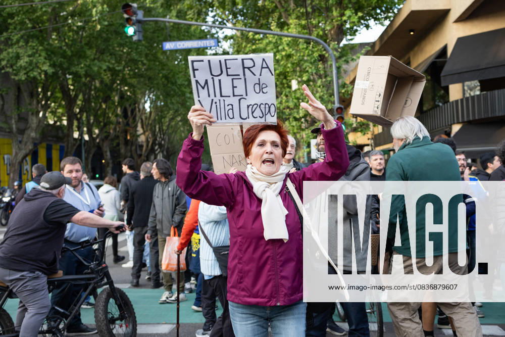 A protester holds a sign during the launch of Argentine President Javier Mileiâ€⠢s new book at Movistar Arena in the Villa Crespo neighborhood. Buenos Aires Argentina - ZUMAp265 20251006_zip_p265_006